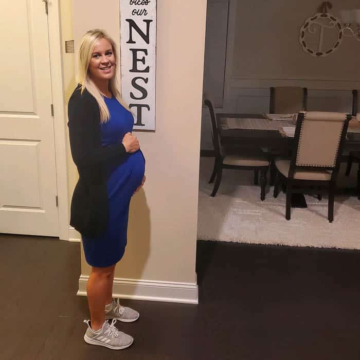 8 months pregnant in tennis shoes before work