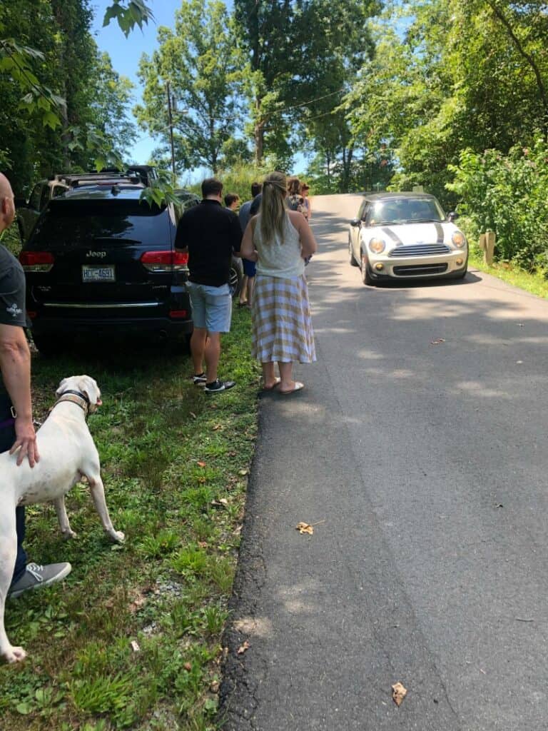 Family lined up outside to greet Lindsey's mom for her surprise party