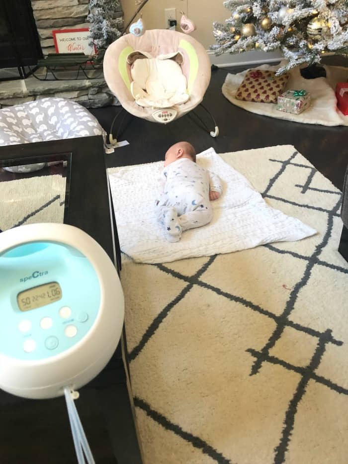 The pump sitting on the coffee table and Jacob doing tummy time