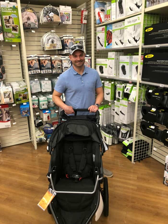 Joey pushing a stroller at Buy Buy baby