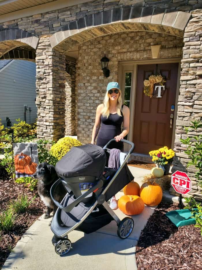 Lindsey by the front porch with the stroller about to head out for a walk