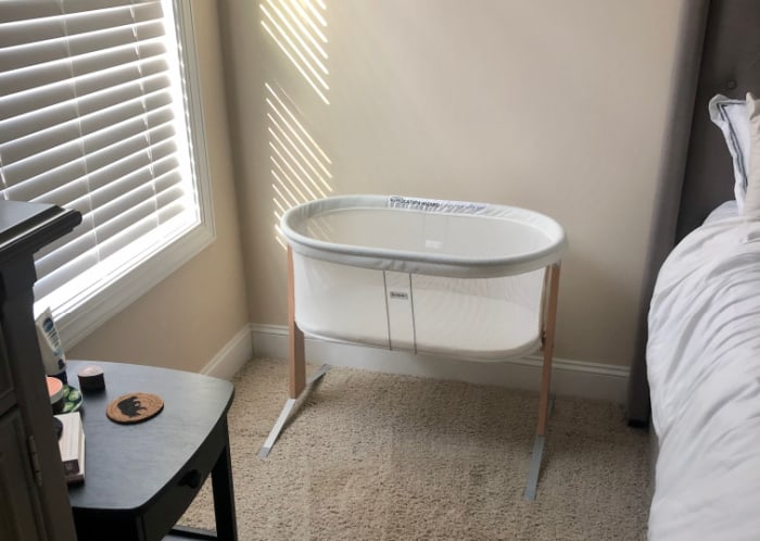 Jacob's bassinet set up next to the bed