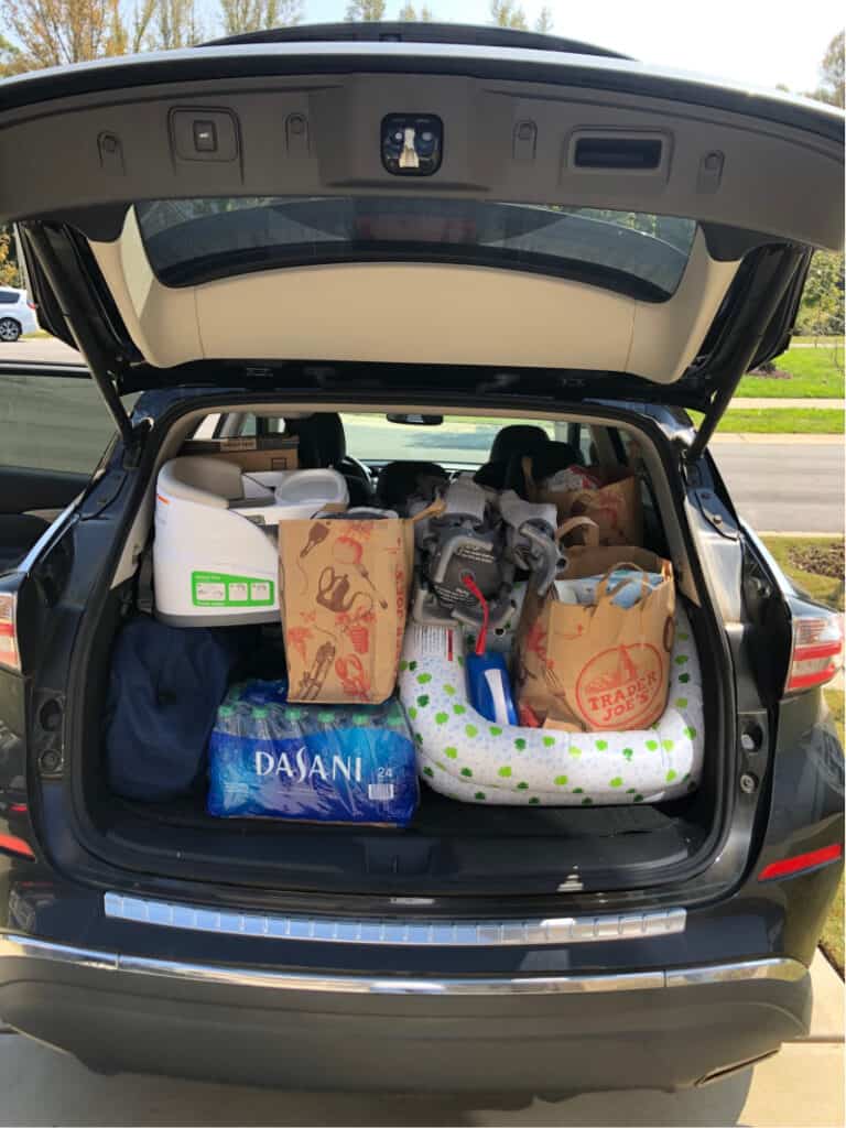 Trunk of the SUV filled to the top with bags