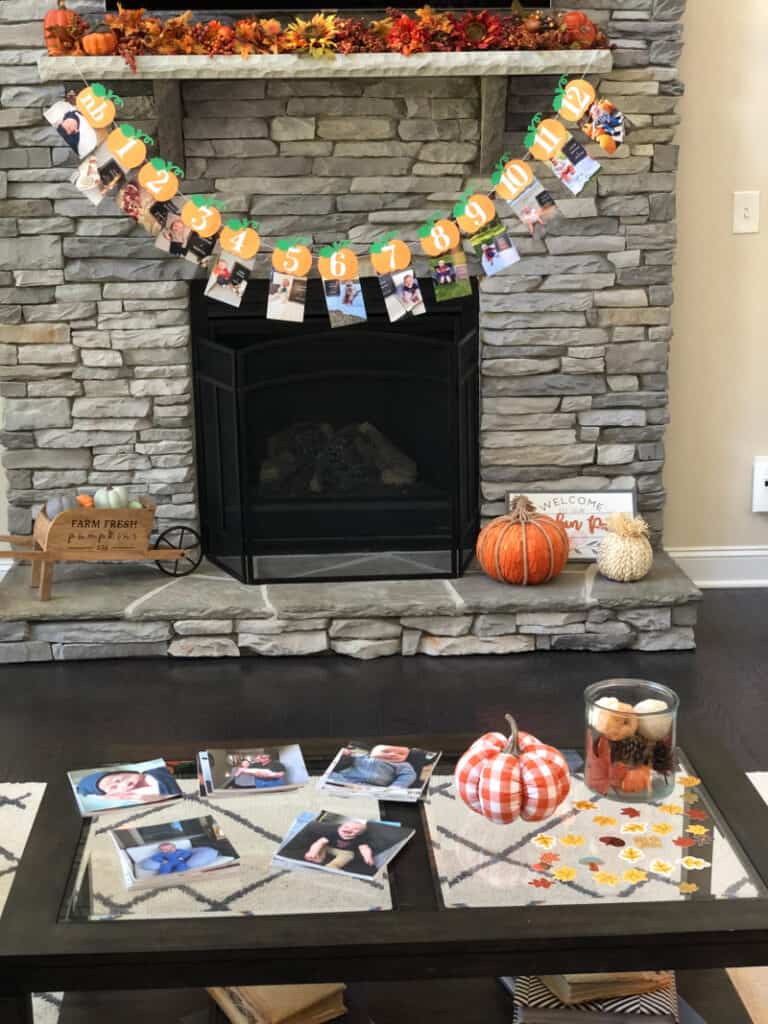 The first year picture banner and the chatbooks photo albums on the coffee table. 