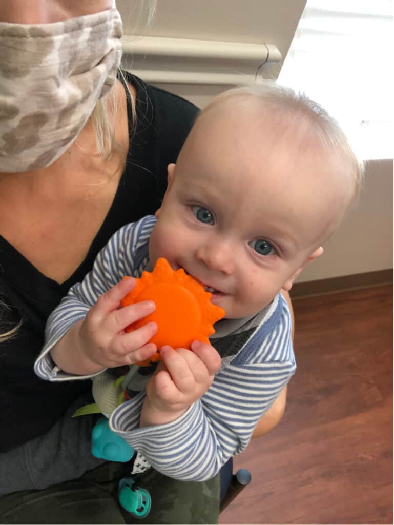 Jacob playing with his toy in the doctor's office. 