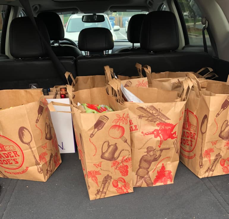 Trader Joe's grocery bags in the back of the car