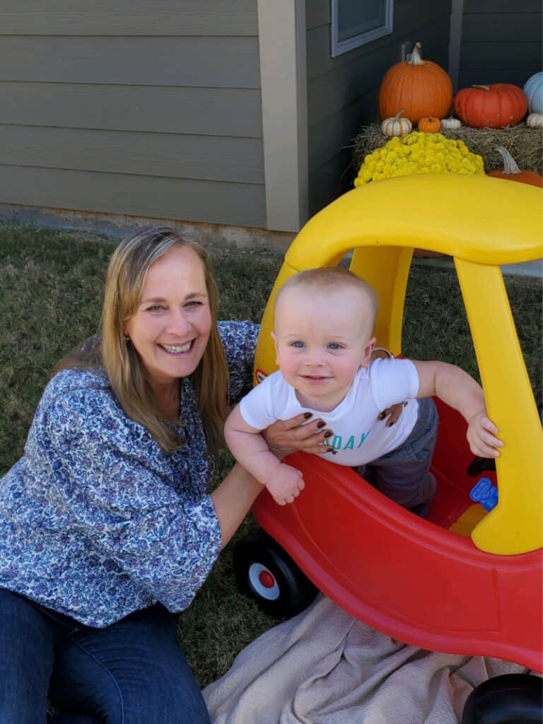 Grammy and Jacob as he smiles in his car.