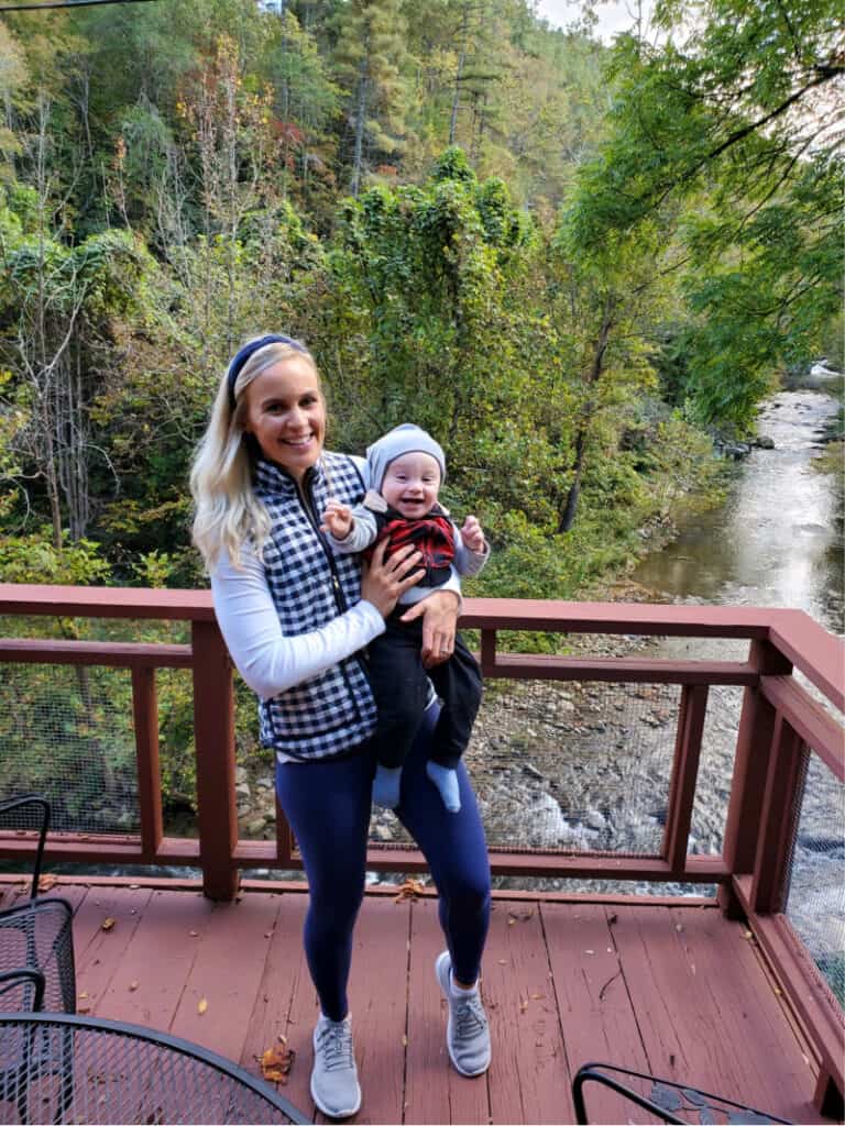 Lindsey and Jacob on the balcony overlooking the creek... Jacob has a huge smile on his face.