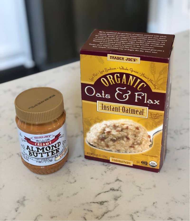 Can of creamy almond butter and a box of instant oatmeal