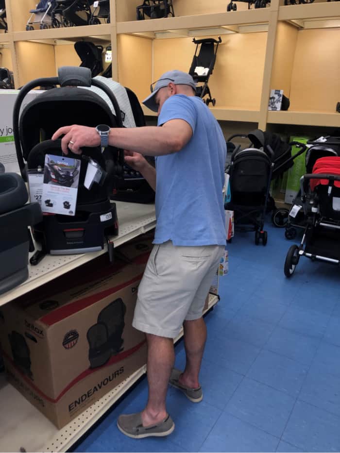 Joey shopping for car seats at BuyBuy baby.