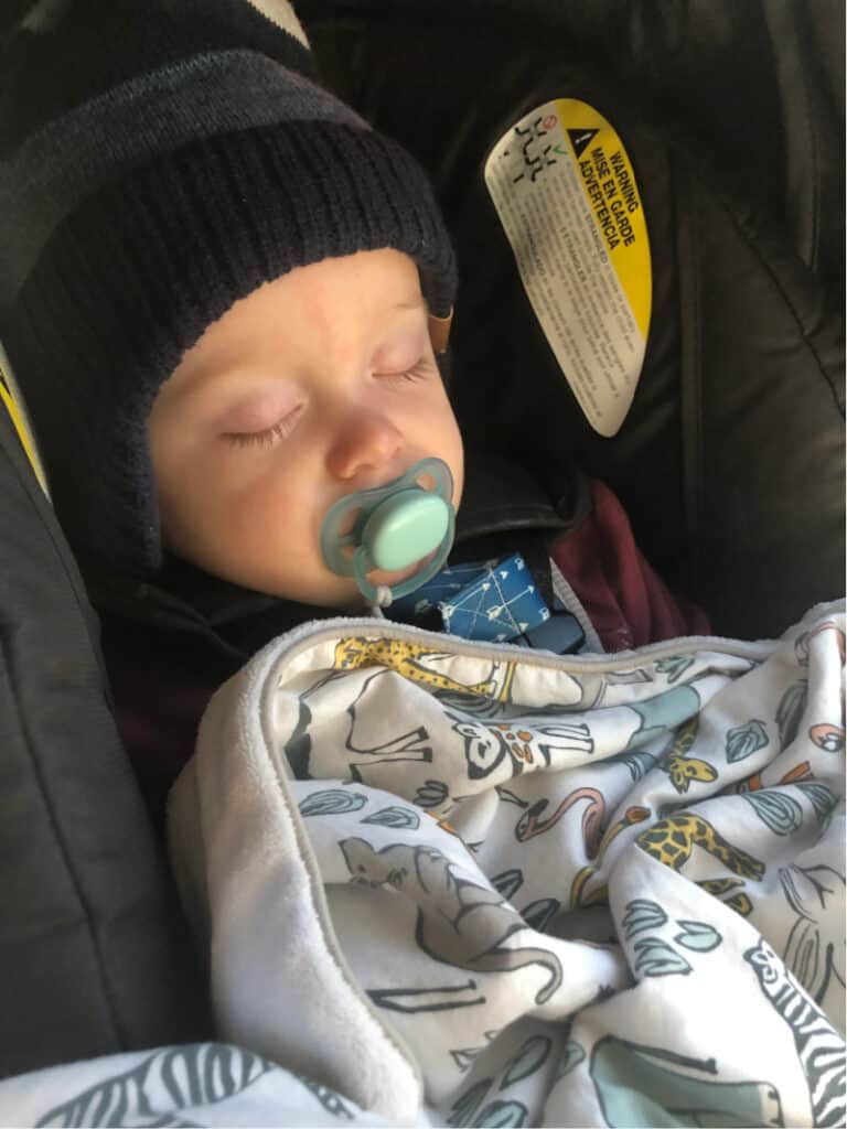 Jacob asleep in his carseat.