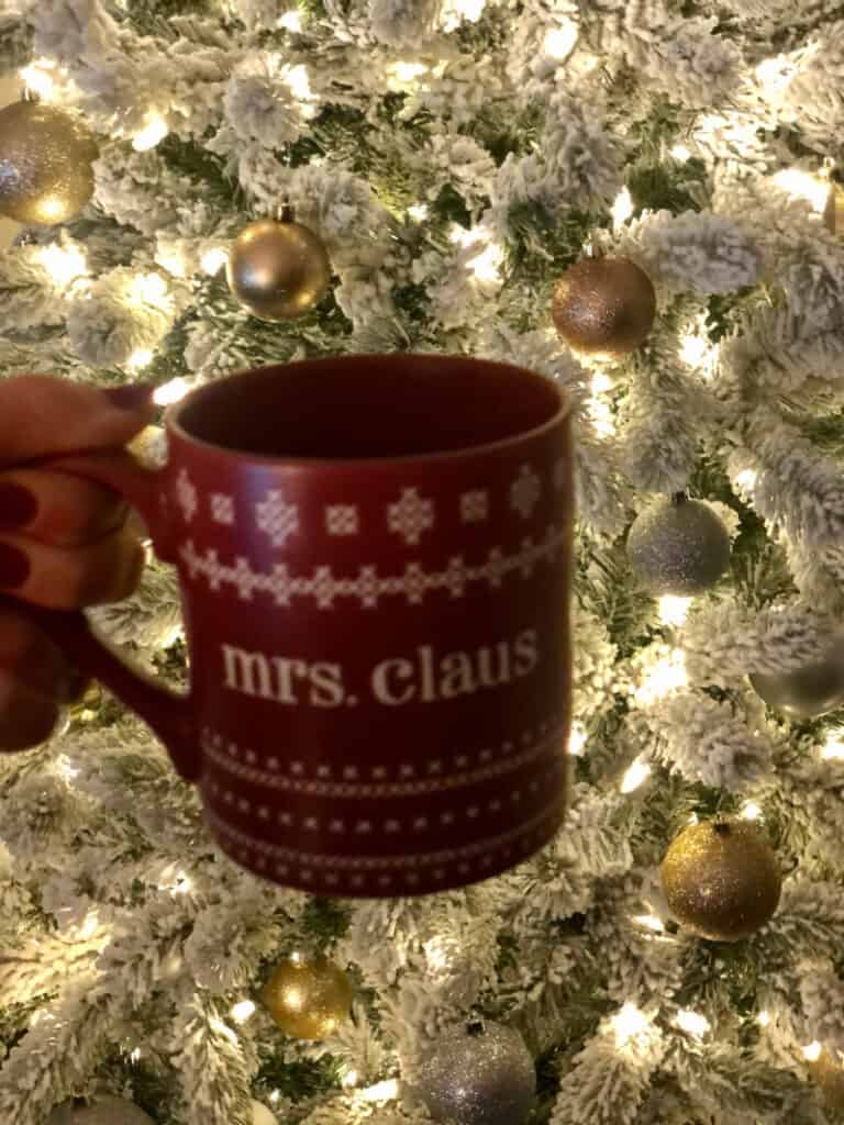 Mrs. Claus coffee mug in front of the Christmas tree