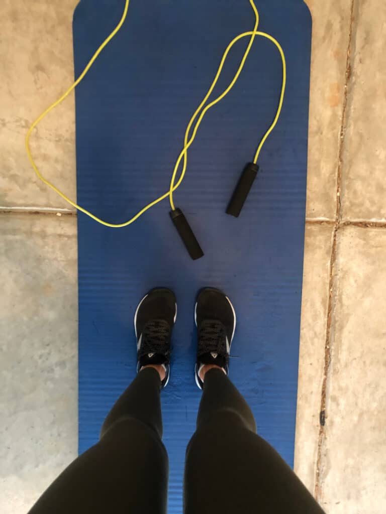 Jump rope and yoga mat in the garage