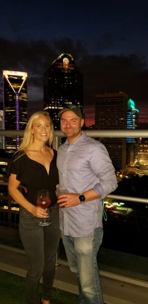 Joey and Lindsey with the Charlotte skyline behind them