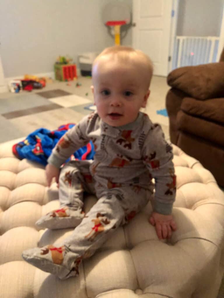 Jacob smirking on the ottoman.