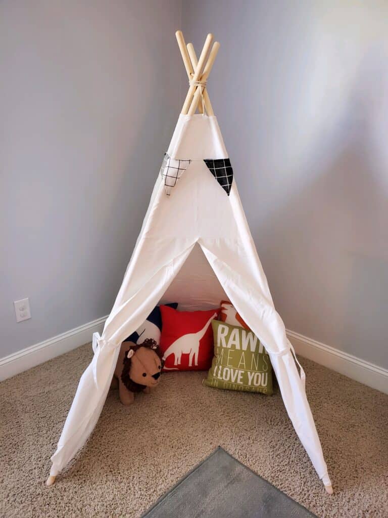 The play tent with pillows. 