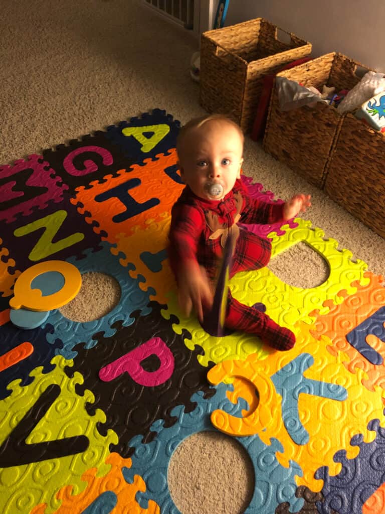 Jacob throwing his alphabet letters.