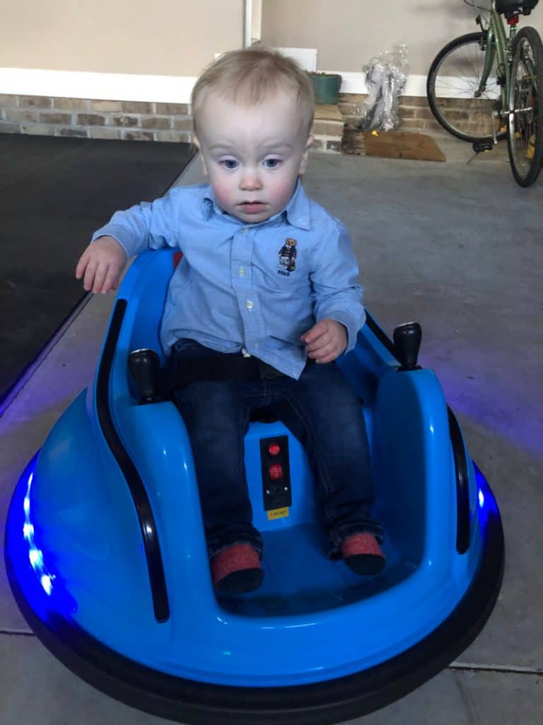 Jacob looking worried on a bumper car