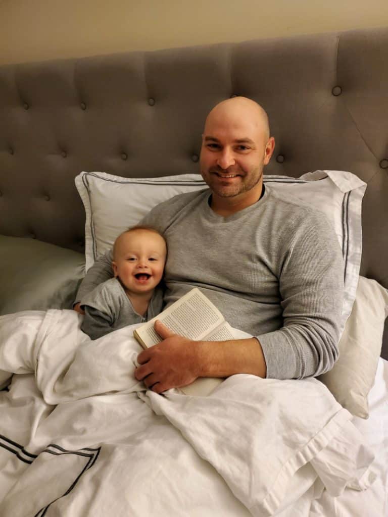 Jacob smiling in bed with Joey