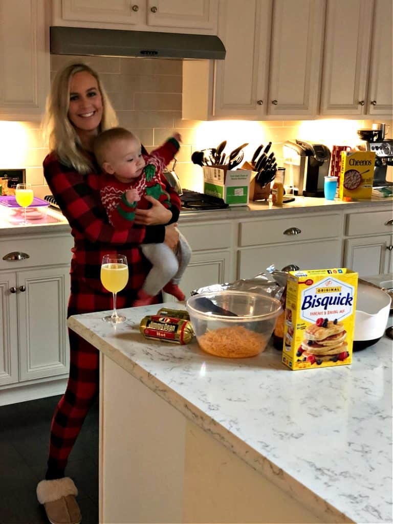 Lindsey holding Jacob in the kitchen as he squirms