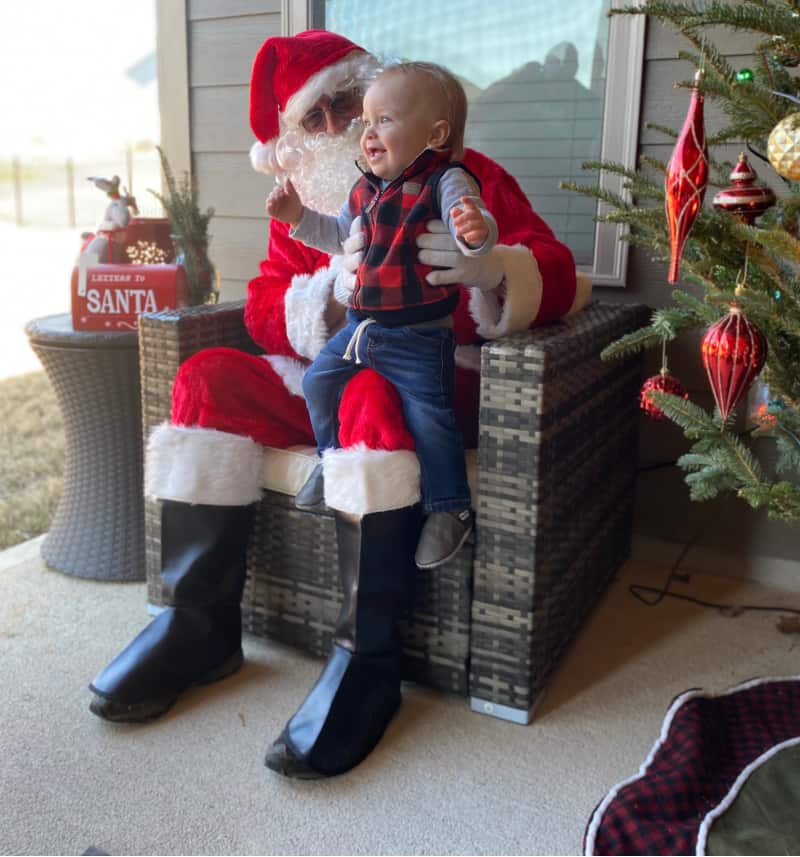 Jacob smiling on Santa's lap