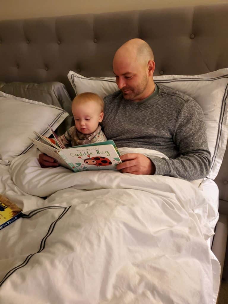 Jacob and Joey reading together in bed